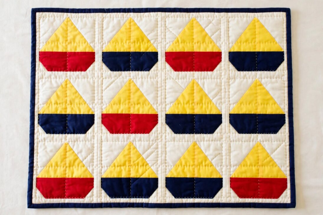 baby quilt sailboat flatlay